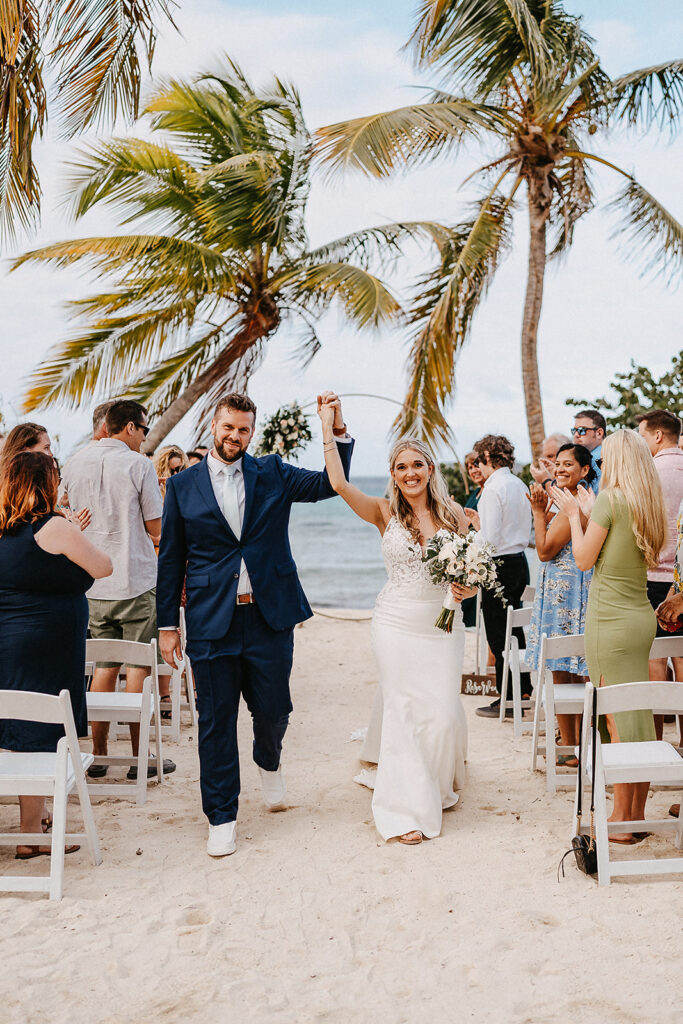 bride and groom celebrating after their beach ceremony is USVI