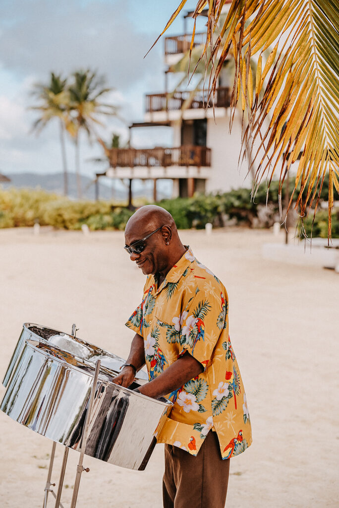 congo man playing on sapphire beach resort during wedding 