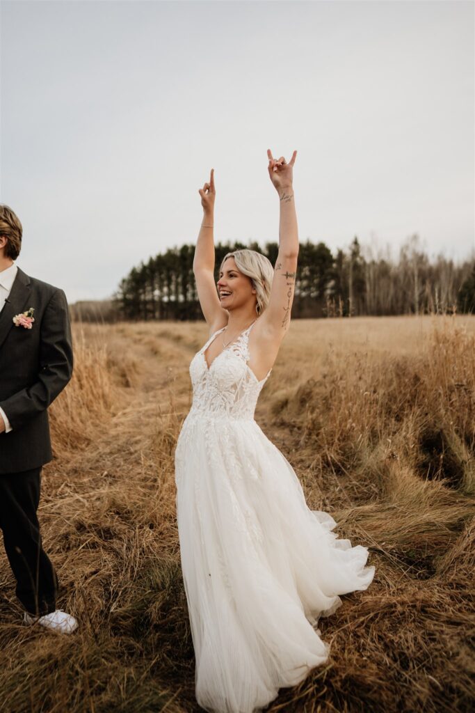 Bride excited in field at ivy black 