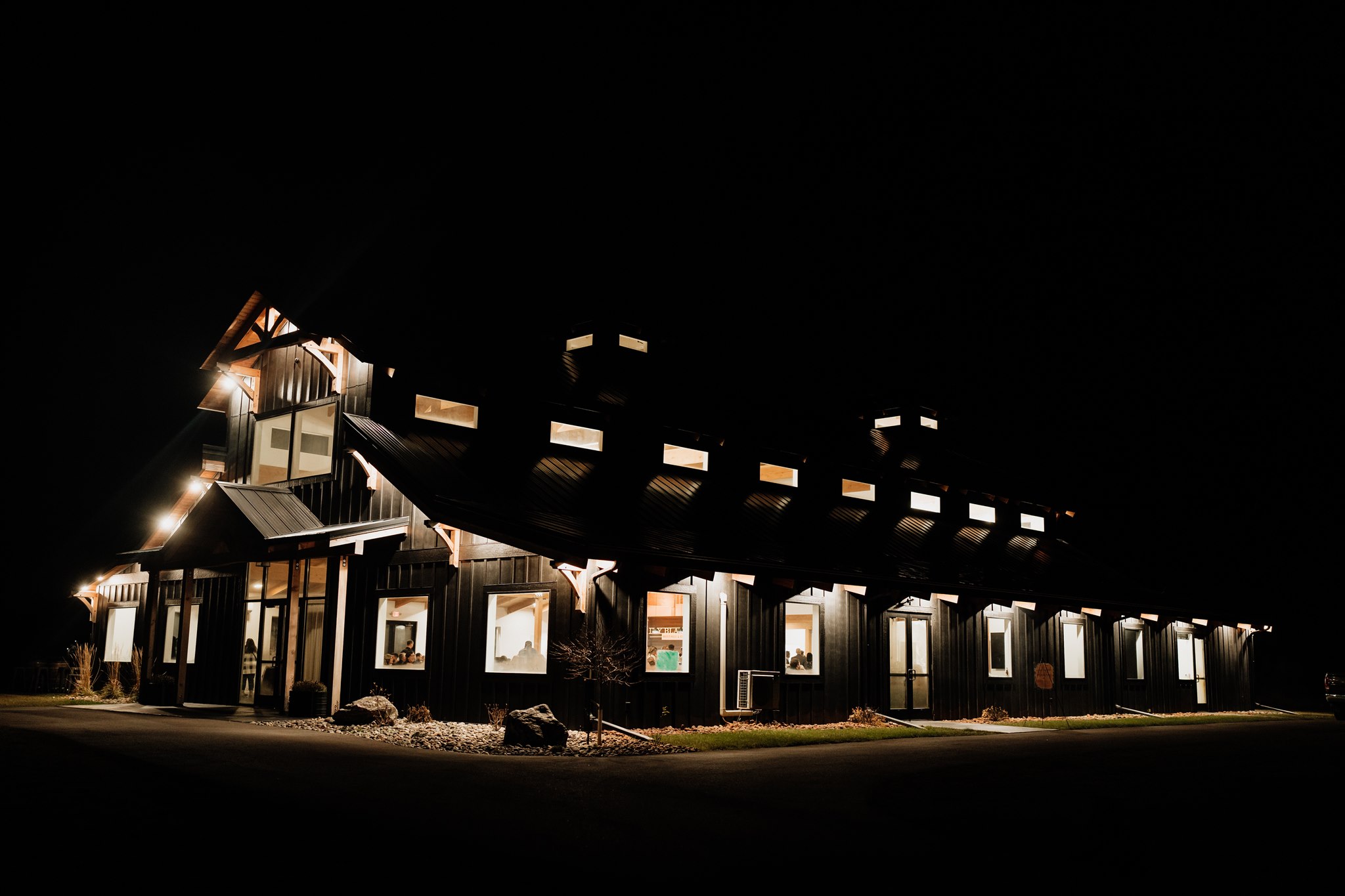 night photo of ivy black barn