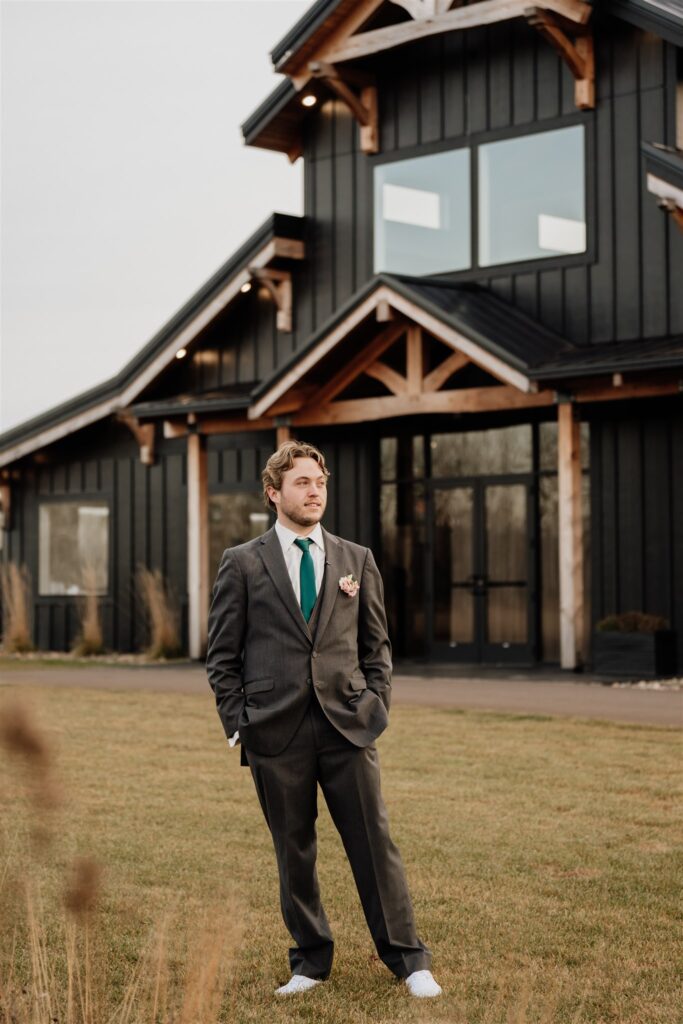 groom portrait outside at ivy black wedding venue