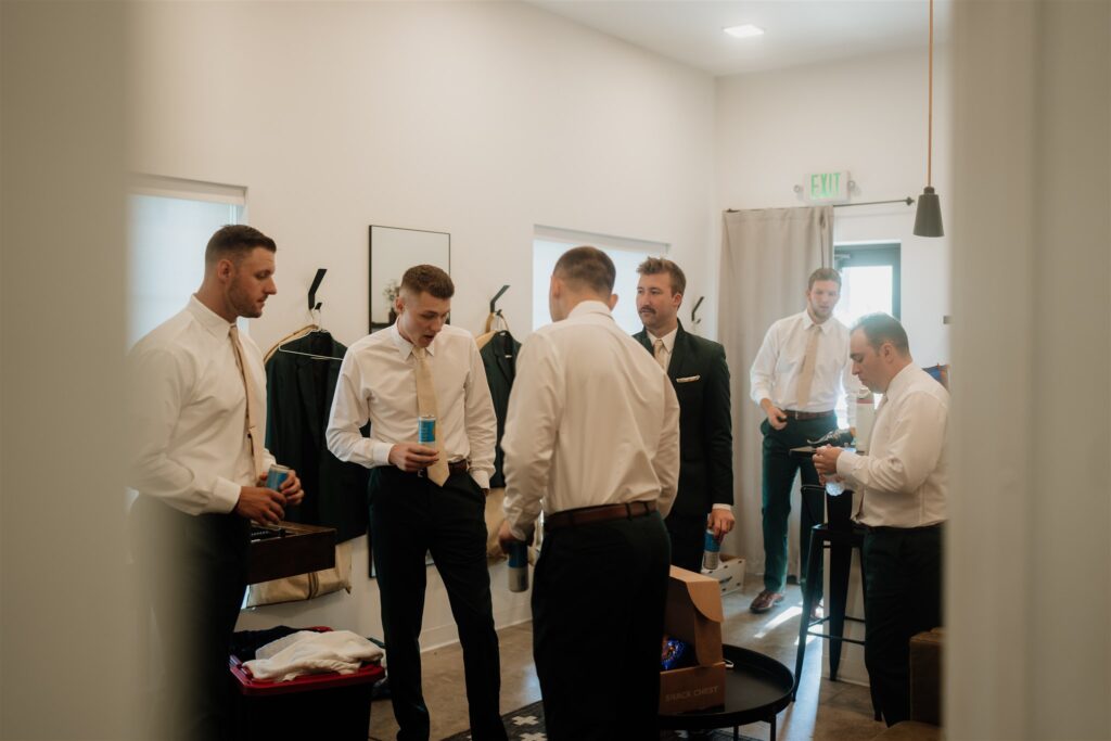 Minneapolis wedding photographer and videographer shoot groomsmen getting ready photos at pinewood